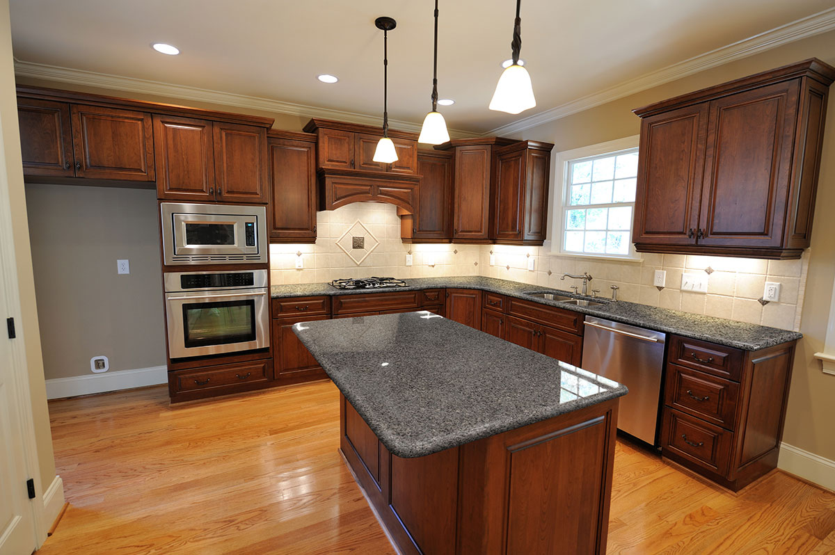 Azul platino granite dark cabinets